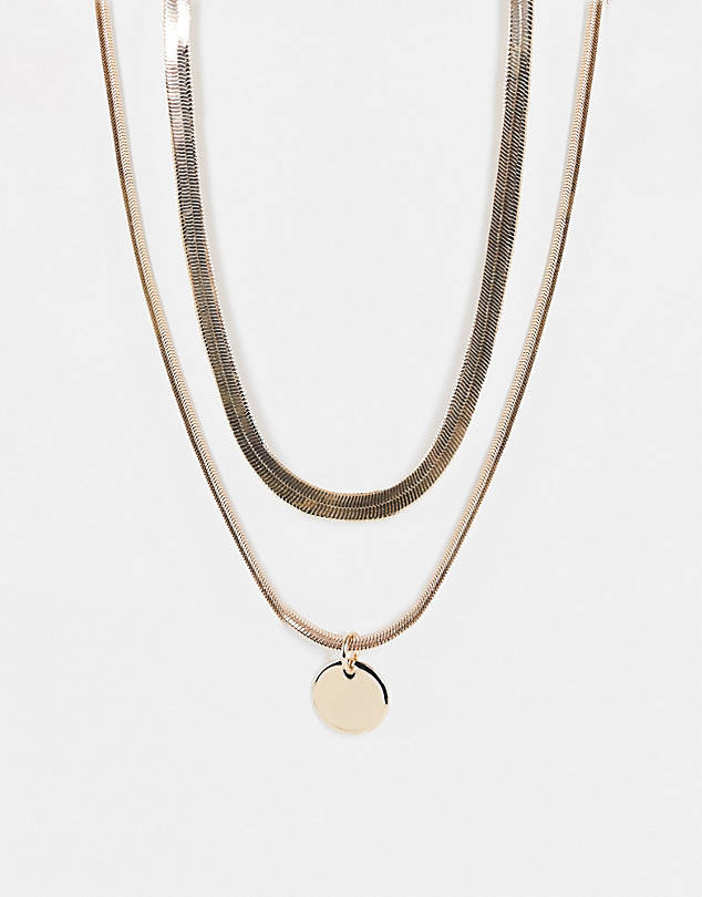 Multirow necklace with disc pendant in gold tone