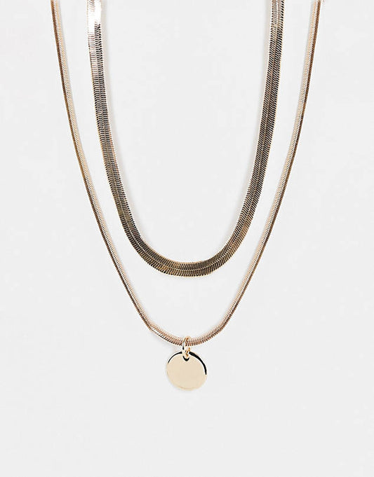 Multirow necklace with disc pendant in gold tone